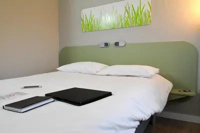 Un ou plusieurs lits dans un hébergement de l'établissement ibis budget Rouen Parc des Expos Zenith