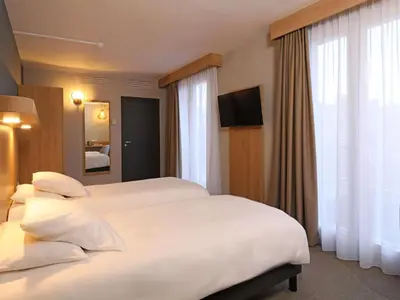 Un ou plusieurs lits dans un hébergement de l'établissement Mercure Abbeville Centre – Porte de La Baie de Somme
