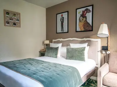 Un ou plusieurs lits dans un hébergement de l'établissement Hotel Novotel Domaine de Maffliers - Paris Val-d'Oise