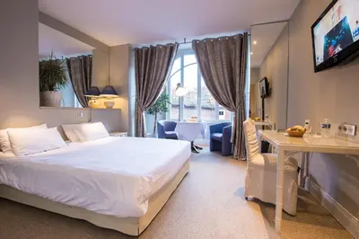 Un ou plusieurs lits dans un hébergement de l'établissement Chenal Hotel