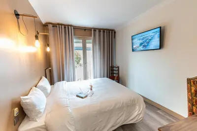 Un ou plusieurs lits dans un hébergement de l'établissement Chenal Hotel