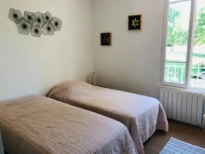 Un ou plusieurs lits dans un hébergement de l'établissement Gite du manoir de l'étang