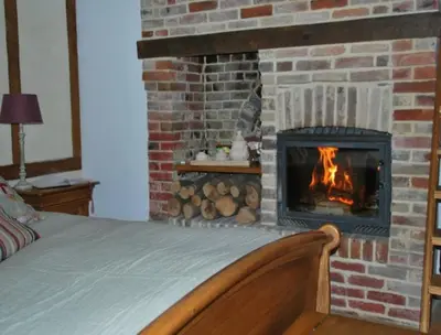 Un ou plusieurs lits dans un hébergement de l'établissement Chambres d'hôtes La Petite Flambée