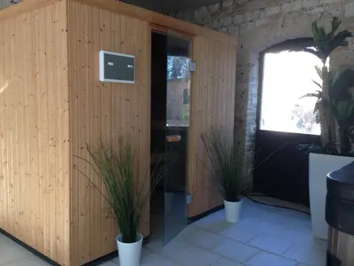 Télévision ou salle de divertissement dans l'établissement Le Château de Grèges