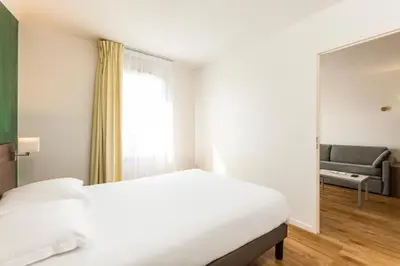 Un ou plusieurs lits dans un hébergement de l'établissement Aparthotel Adagio Access Carrières Sous Poissy