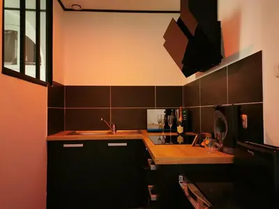 Cuisine ou kitchenette dans l'établissement Les Sansonnets Appart & Spa