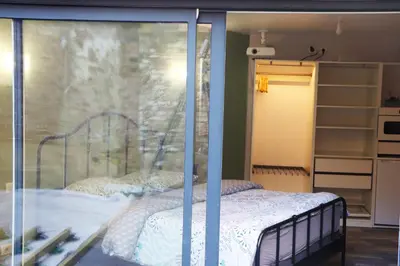 Un ou plusieurs lits dans un hébergement de l'établissement Suite Melody double balnéo, home-cinéma, terrasse à Dieppe