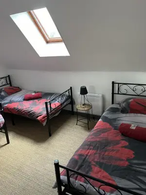 Un ou plusieurs lits dans un hébergement de l'établissement Gîte du Domaine de La Reine Blanche