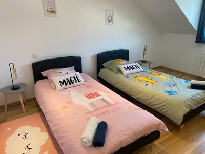 Un ou plusieurs lits dans un hébergement de l'établissement Family Villa 29
