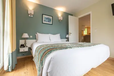 Un ou plusieurs lits dans un hébergement de l'établissement Club Wyndham Normandy
