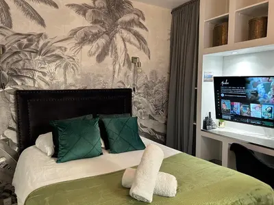 Un ou plusieurs lits dans un hébergement de l'établissement Appart'TERRASSE - 20mn STADE U ARENA - CHAMPS ÉLYSÉES - RER A