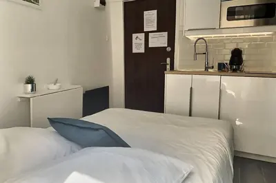 Un ou plusieurs lits dans un hébergement de l'établissement Appart' Studette Cosy - STADE U ARENA