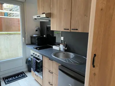 Cuisine ou kitchenette dans l'établissement Le Bohème - Appartement proche gare et commerces