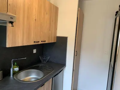 Cuisine ou kitchenette dans l'établissement Le Bohème - Appartement proche gare et commerces
