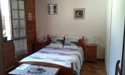 Un ou plusieurs lits dans un hébergement de l'établissement Au Grand Sapin Chambres chez l'habitant