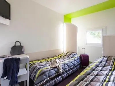 Un ou plusieurs lits dans un hébergement de l'établissement MELINESS Hotel