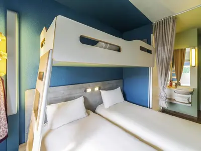 Un ou plusieurs lits dans un hébergement de l'établissement Ibis budget Rouen Petit Quevilly