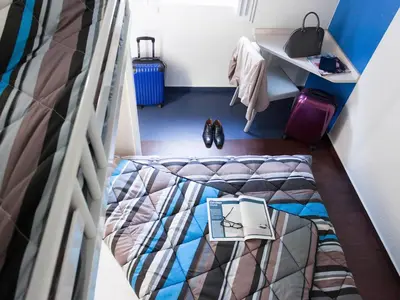 Un ou plusieurs lits dans un hébergement de l'établissement Hotel First Eco Dieppe