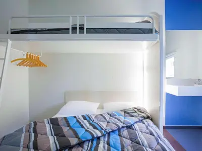 Un ou plusieurs lits dans un hébergement de l'établissement Hotel First Eco Dieppe