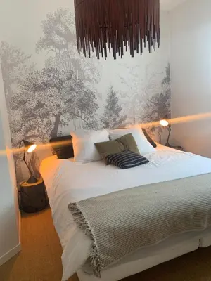 Un ou plusieurs lits dans un hébergement de l'établissement Les Chambres du Verger