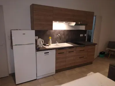 Cuisine ou kitchenette dans l'établissement Contre vents et marées