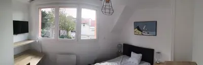 Télévision ou salle de divertissement dans l'établissement Contre vents et marées