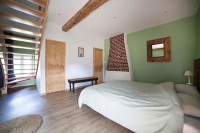 Un ou plusieurs lits dans un hébergement de l'établissement Les Chambres d'hotes de Sophie