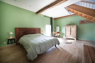 Un ou plusieurs lits dans un hébergement de l'établissement Les Chambres d'hotes de Sophie