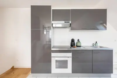 Cuisine ou kitchenette dans l'établissement GRAND CONFORT, Appartement Osny