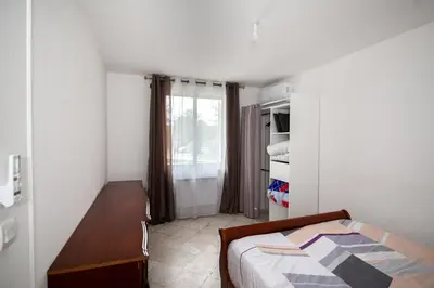 Un ou plusieurs lits dans un hébergement de l'établissement Appartement 3pieces