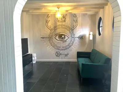 Coin salon dans l'établissement Le charme et l’original