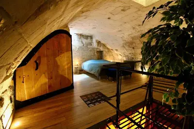 Un ou plusieurs lits dans un hébergement de l'établissement L'Atelier 1742 - Atypique jacuzzi Rouen Centre