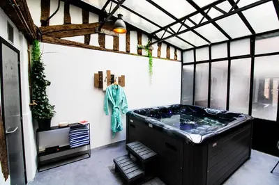 Un ou plusieurs lits dans un hébergement de l'établissement L'Atelier 1742 - Atypique jacuzzi Rouen Centre