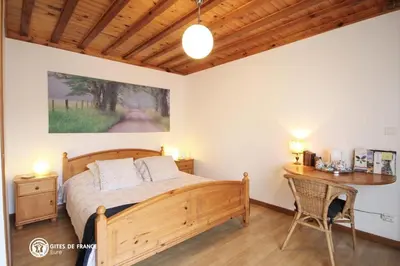 Un ou plusieurs lits dans un hébergement de l'établissement Les Chambres du Chataignier