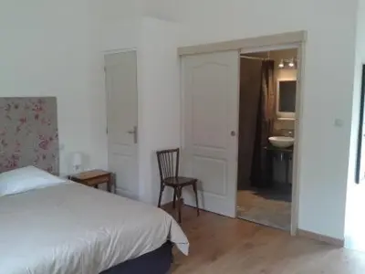 Un ou plusieurs lits dans un hébergement de l'établissement Chambres du Campreux