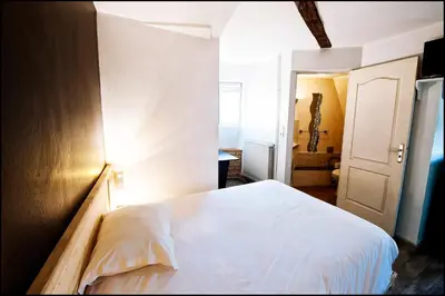 Un ou plusieurs lits dans un hébergement de l'établissement Hôtel du Nord