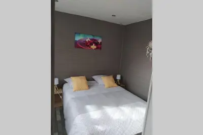 Un ou plusieurs lits dans un hébergement de l'établissement Tiny house