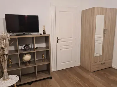 Télévision ou salle de divertissement dans l'établissement Appartement de vacances a St Pierre du Vauvray