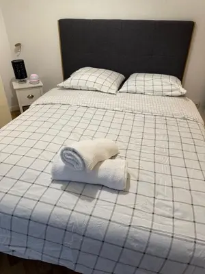 Un ou plusieurs lits dans un hébergement de l'établissement SPACIEUX Appartement de Charme, près de Paris