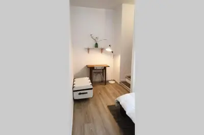 Un ou plusieurs lits dans un hébergement de l'établissement Appartement cosy proche du CHU