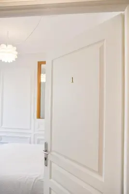 Un ou plusieurs lits dans un hébergement de l'établissement Les Matelots Rouen Centre by MyFrenchPAT