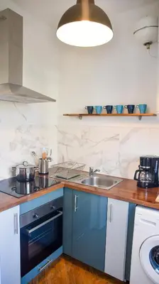 Cuisine ou kitchenette dans l'établissement Les Matelots Rouen Centre by MyFrenchPAT