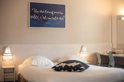 Un ou plusieurs lits dans un hébergement de l'établissement ACE Hôtel Rouen Parc des Expositions