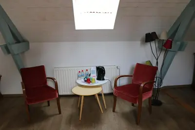 Coin salon dans l'établissement Au Relais de Chaussy