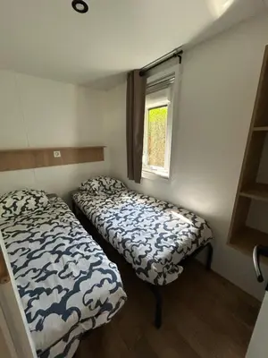 Un ou plusieurs lits dans un hébergement de l'établissement Camping les Marguerites