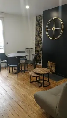Coin salon dans l'établissement L'escale - Appartement en centre ville