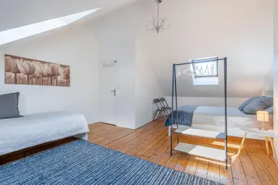 Un ou plusieurs lits dans un hébergement de l'établissement Maison Famille-Confort-Terrasse Jardin-Vue Cathédrale