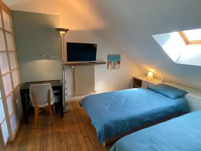 Un ou plusieurs lits dans un hébergement de l'établissement La Chambre Claire