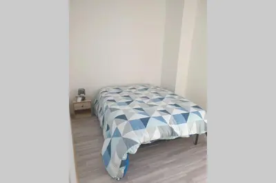 Un ou plusieurs lits dans un hébergement de l'établissement appartement laïs