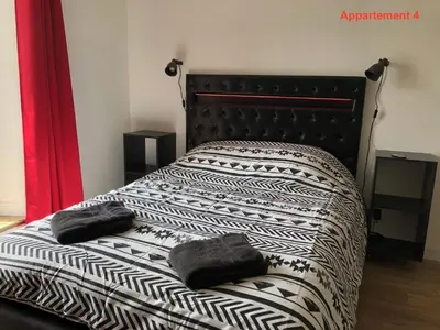 Un ou plusieurs lits dans un hébergement de l'établissement Les appartements du quai